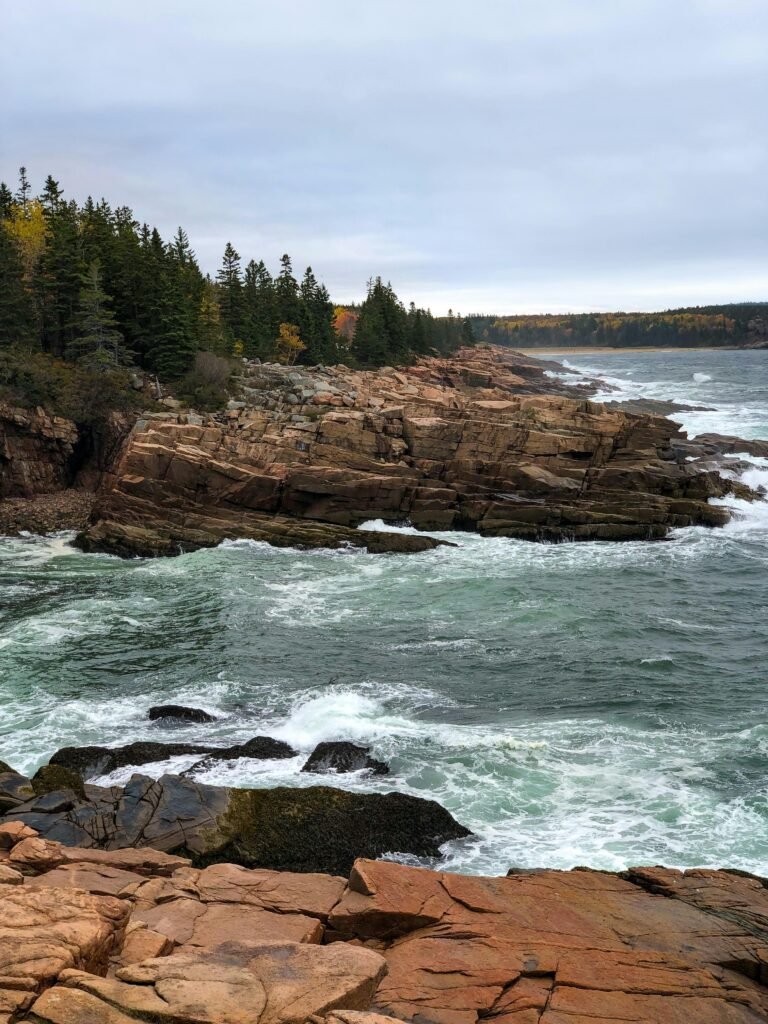 Majestic rocky coastline with waves crashing at Acadia National Park, Bar Harbor, ME.